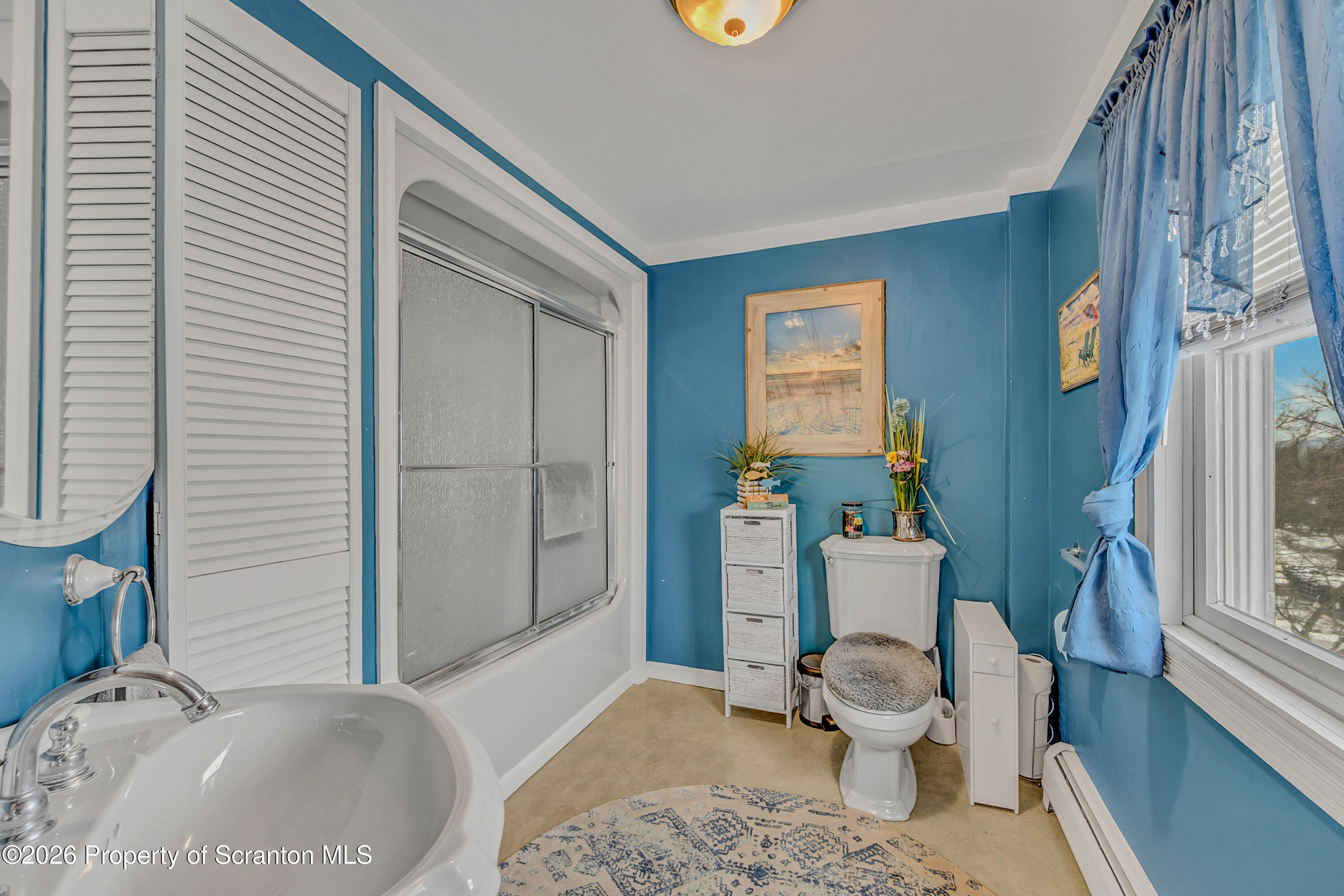 1803 Academy Street Scranton, PA 18504 - Photo 29 of 47 a bathroom with a granite countertop toilet a sink and a mirror