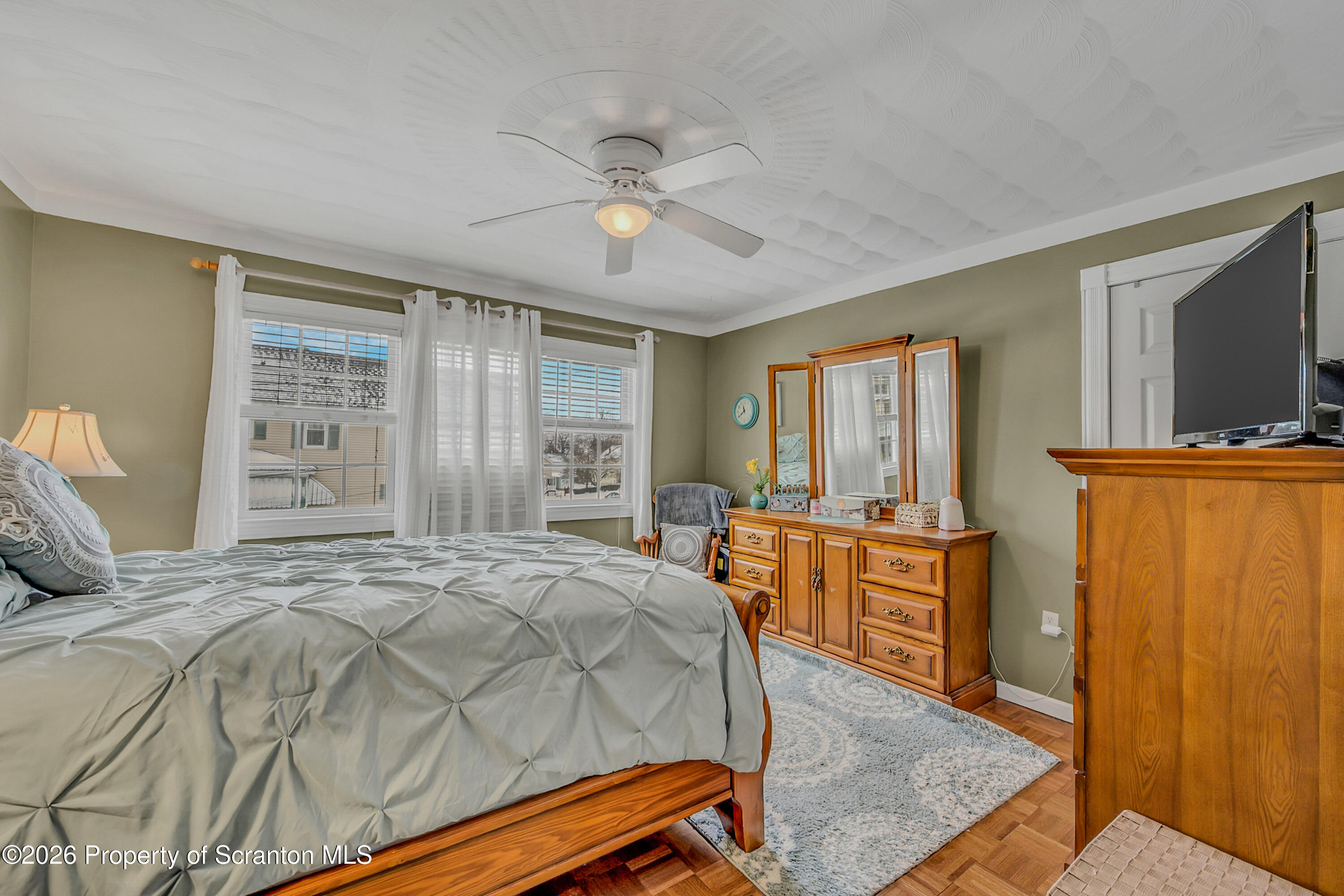 1803 Academy Street Scranton, PA 18504 - Photo 34 of 47 a bedroom with a bed and wooden floor