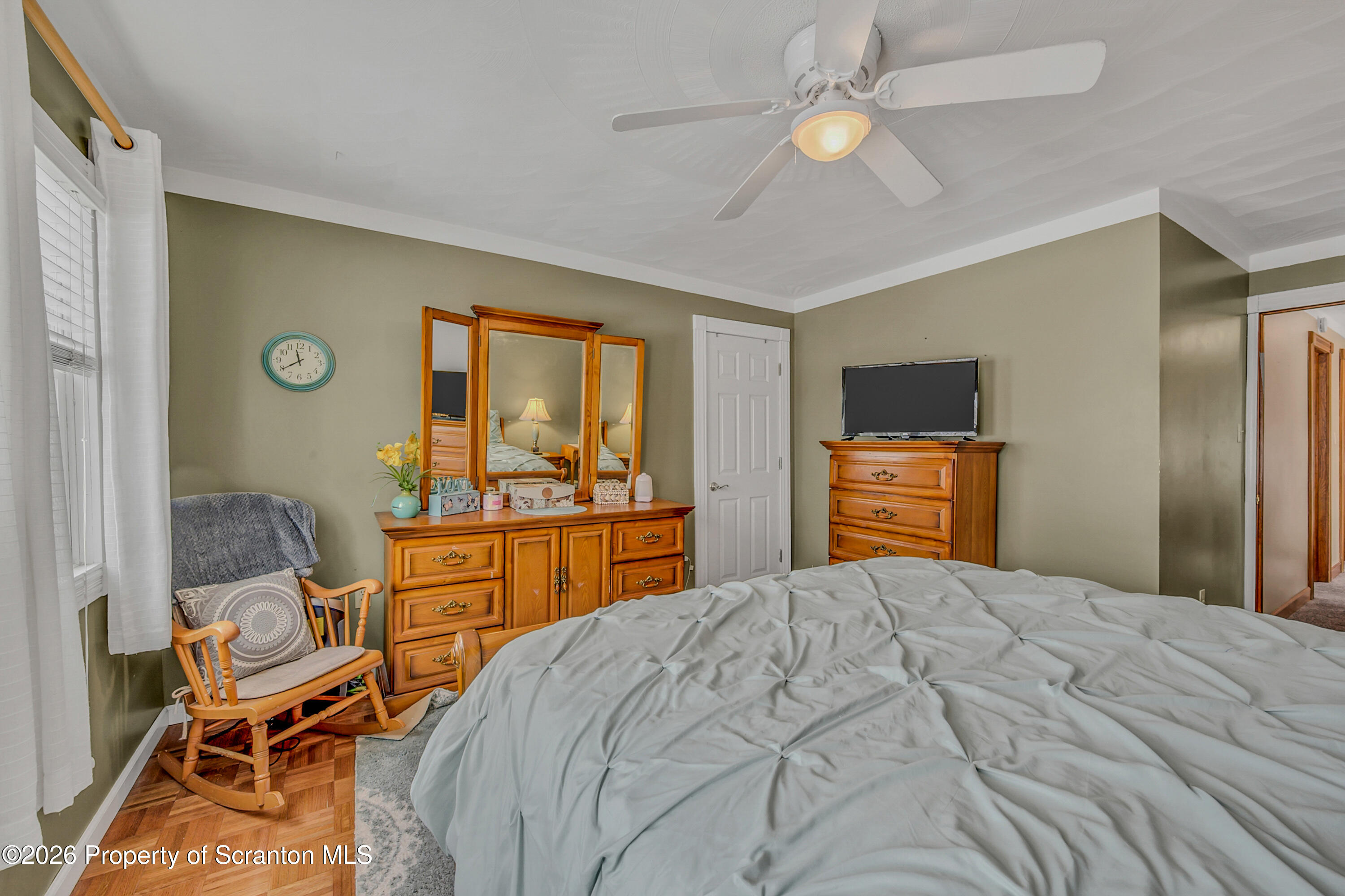 1803 Academy Street Scranton, PA 18504 - Photo 35 of 47 a bedroom with a bed and a chandelier