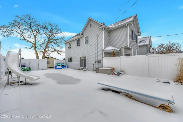 a view of room with wooden floor
