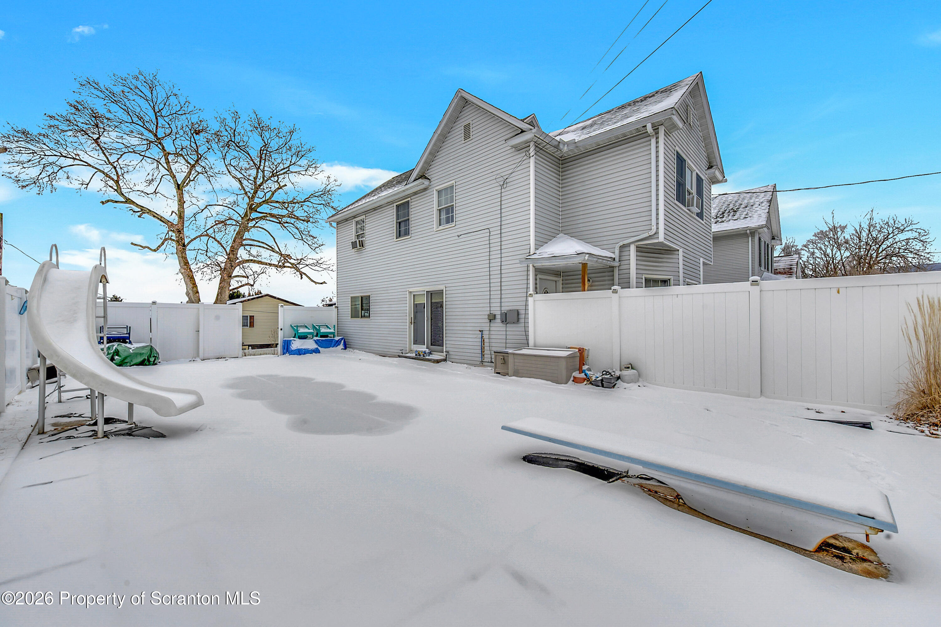 1803 Academy Street Scranton, PA 18504 - Photo 43 of 47 a view of a patio with a table and chairs and potted plants