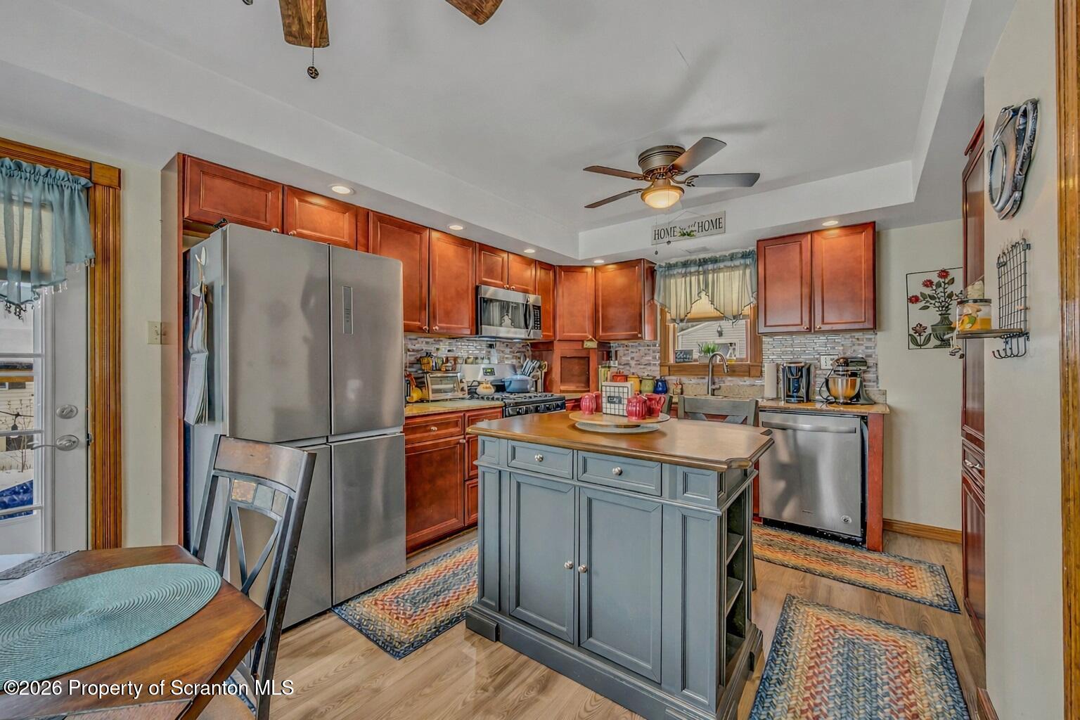 1803 Academy Street Scranton, PA 18504 - Photo 7 of 47 a kitchen with refrigerator cabinets and a sink