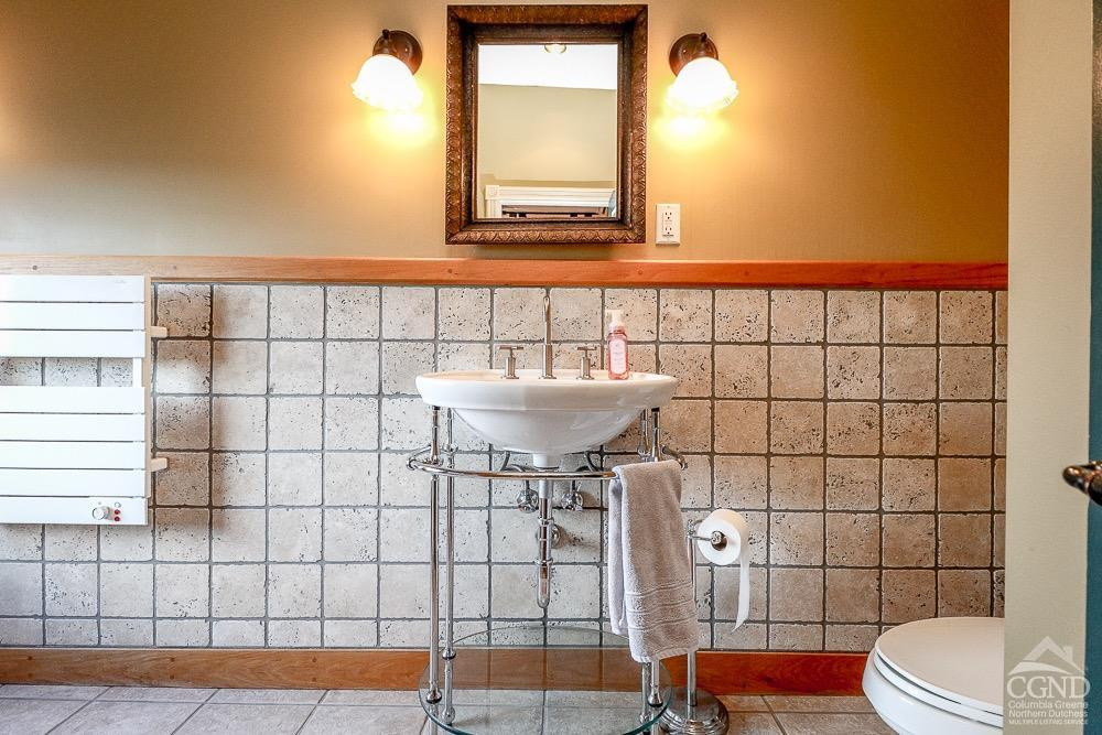 258 Warren Street Hudson, NY 12534 - Photo 11 of 31 a bathroom with a sink toilet and shower