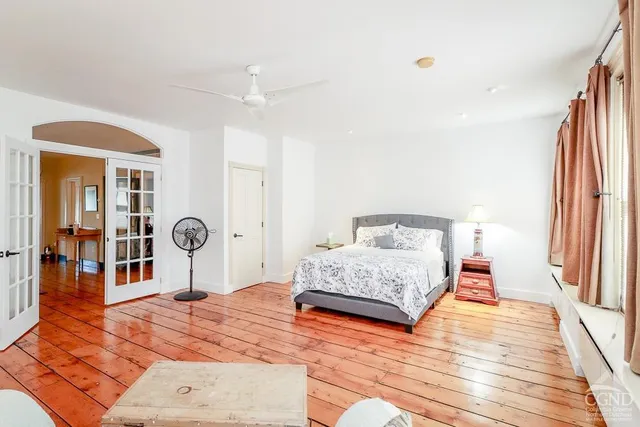 a bedroom with a bed and a view of bathroom