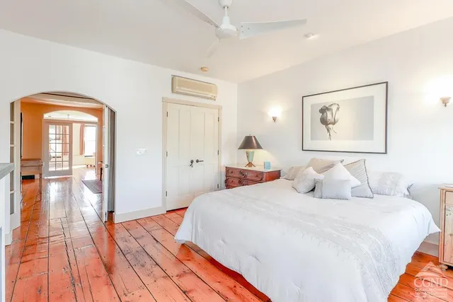 a bedroom with a bed and a fireplace