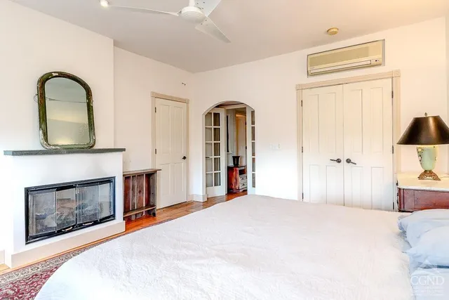 a bedroom with a bed and window