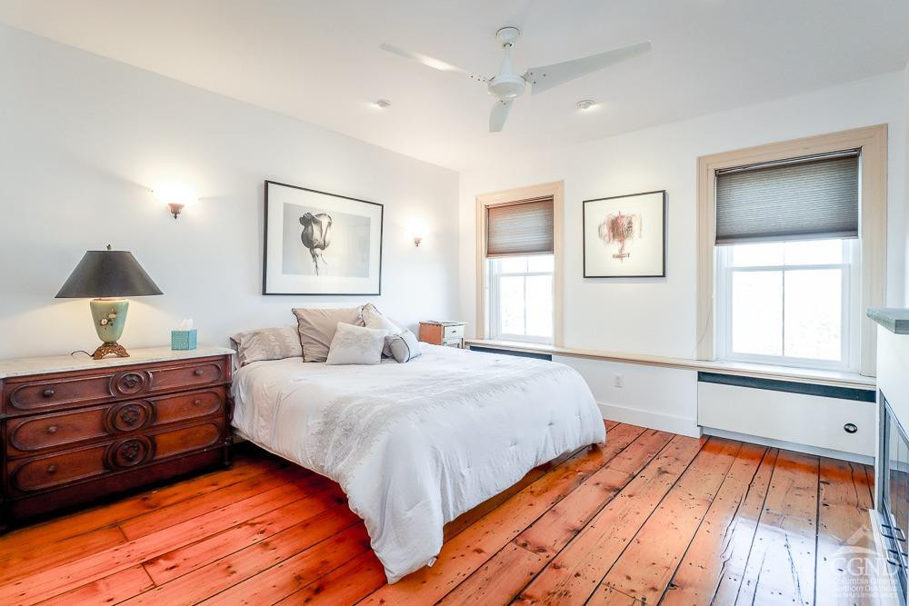 258 Warren Street Hudson, NY 12534 - Photo 22 of 31 a bedroom with a bed and window