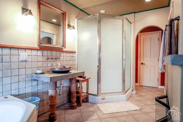 a bathroom with a sink a mirror and a bathtub