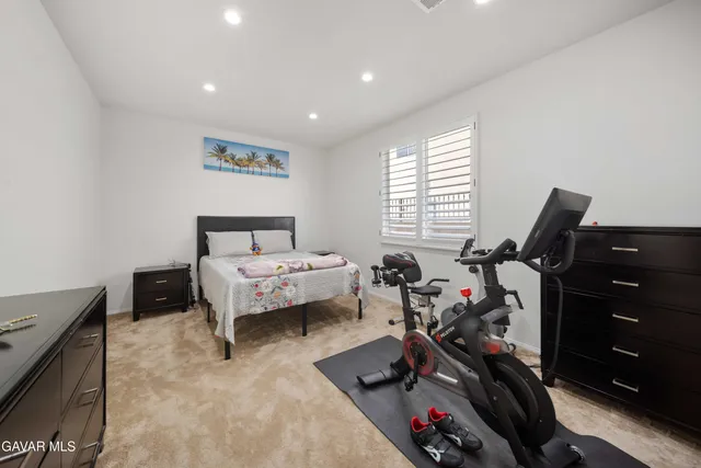 a bed room with a bed and a tv