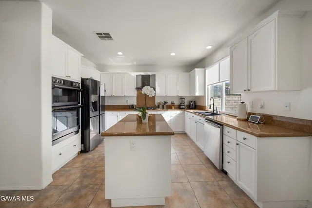a large kitchen with cabinets