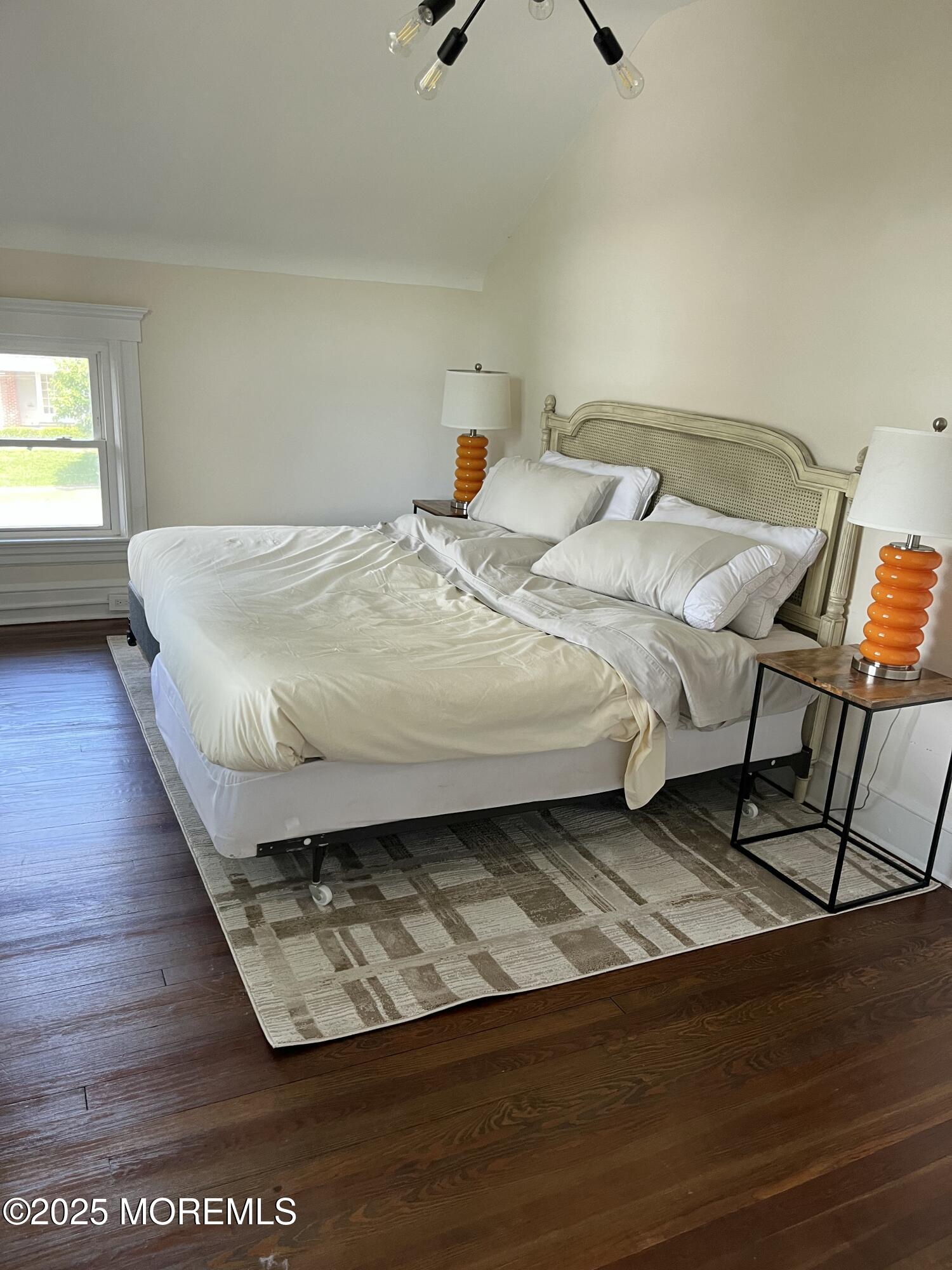 404 Lake Drive Allenhurst, NJ 07711 - Photo 8 of 8 a bed sitting in a bedroom next to a window