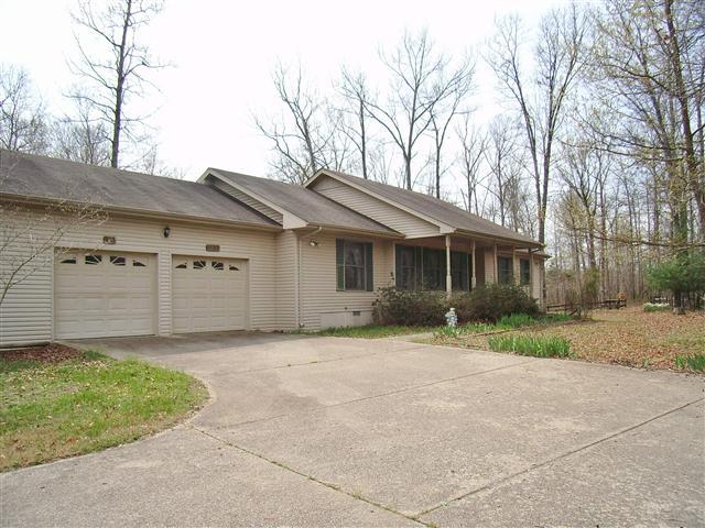 220 Leon Cole Road Dover, TN 37058 - Photo 2 of 20 Large 2-bay attached garage with concrete driveway area, at home.