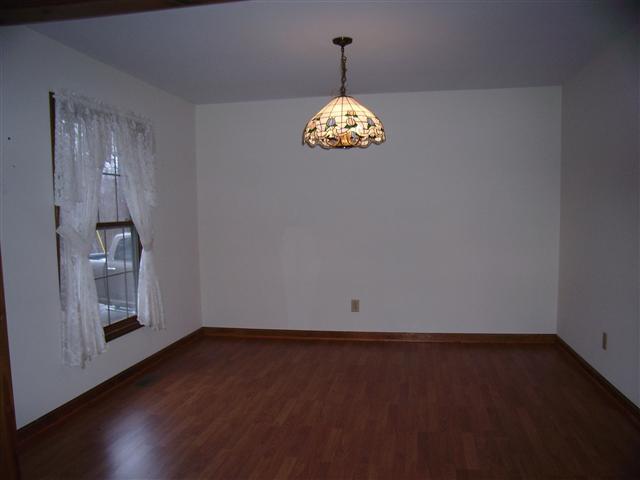220 Leon Cole Road Dover, TN 37058 - Photo 6 of 20 Dining room off of living room. Beautiful light fixture.