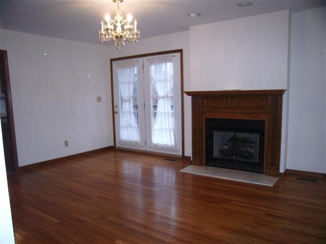 220 Leon Cole Road Dover, TN 37058 - Photo 10 of 20 Family room, hardwood flooring, French doors to sun deck, gas logs fireplace