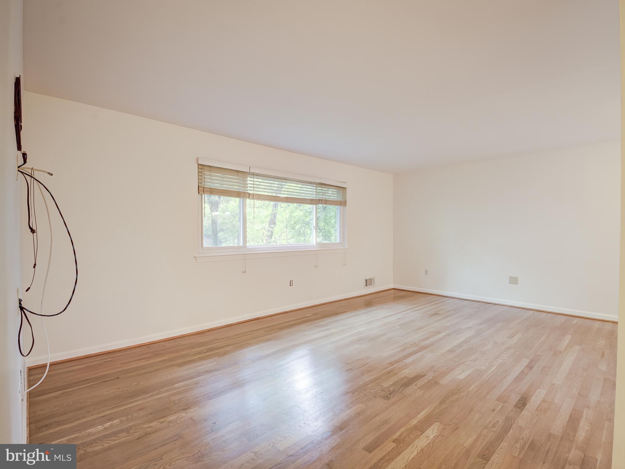 6807 Quebec Court Springfield, VA 22152 - Photo 23 of 59 Living room with just refinished hardwood