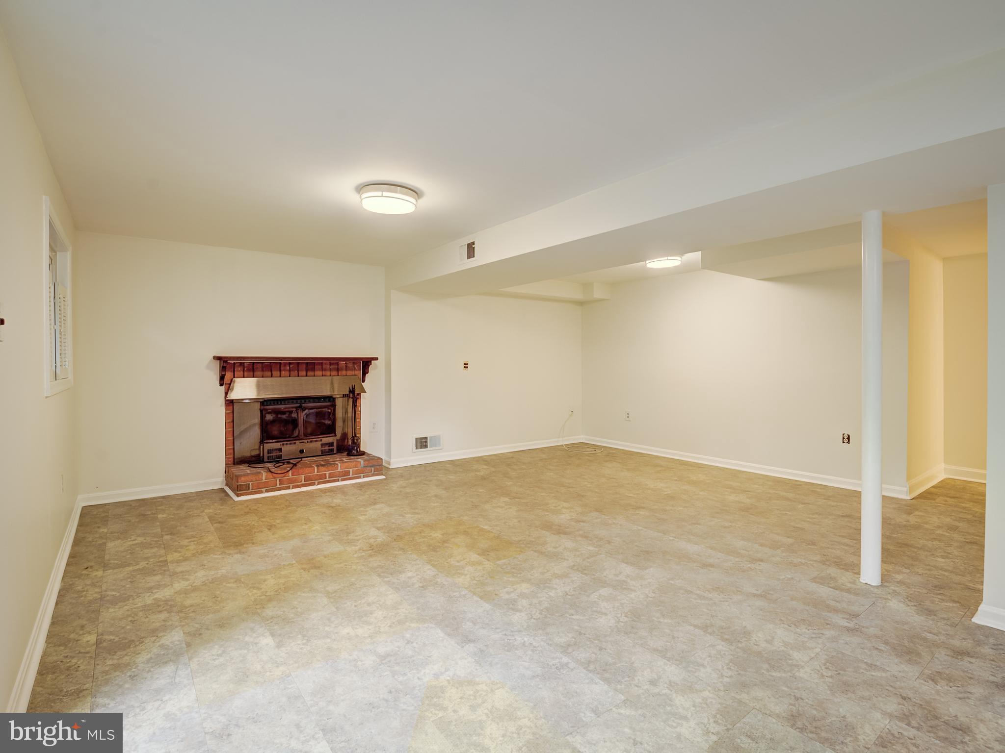 6807 Quebec Court Springfield, VA 22152 - Photo 42 of 59 Wood burning fire place with mantle