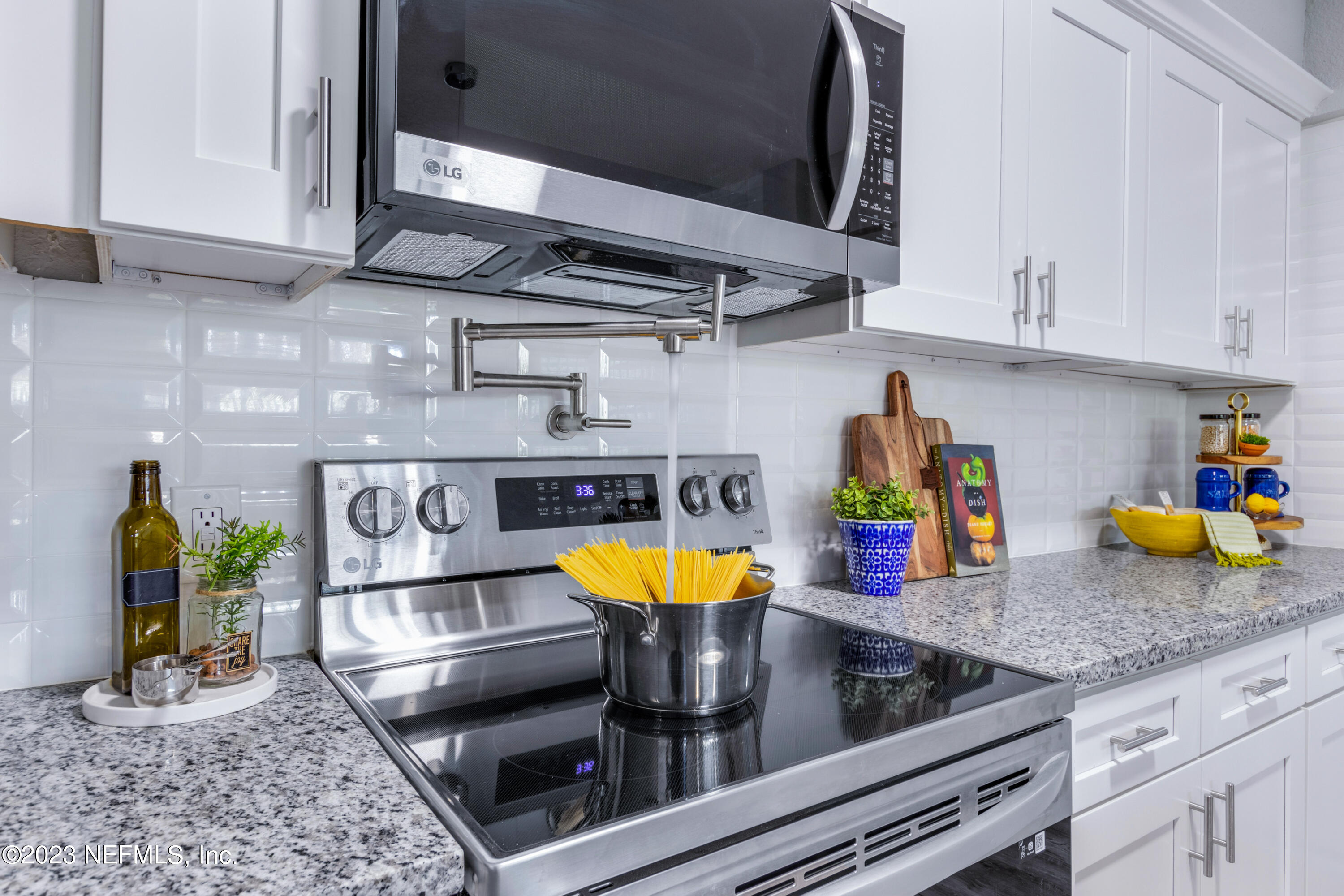 1226 Morgana Road Jacksonville, FL 32211 - Photo 12 of 38 a kitchen with stainless steel appliances granite countertop a sink and cabinets