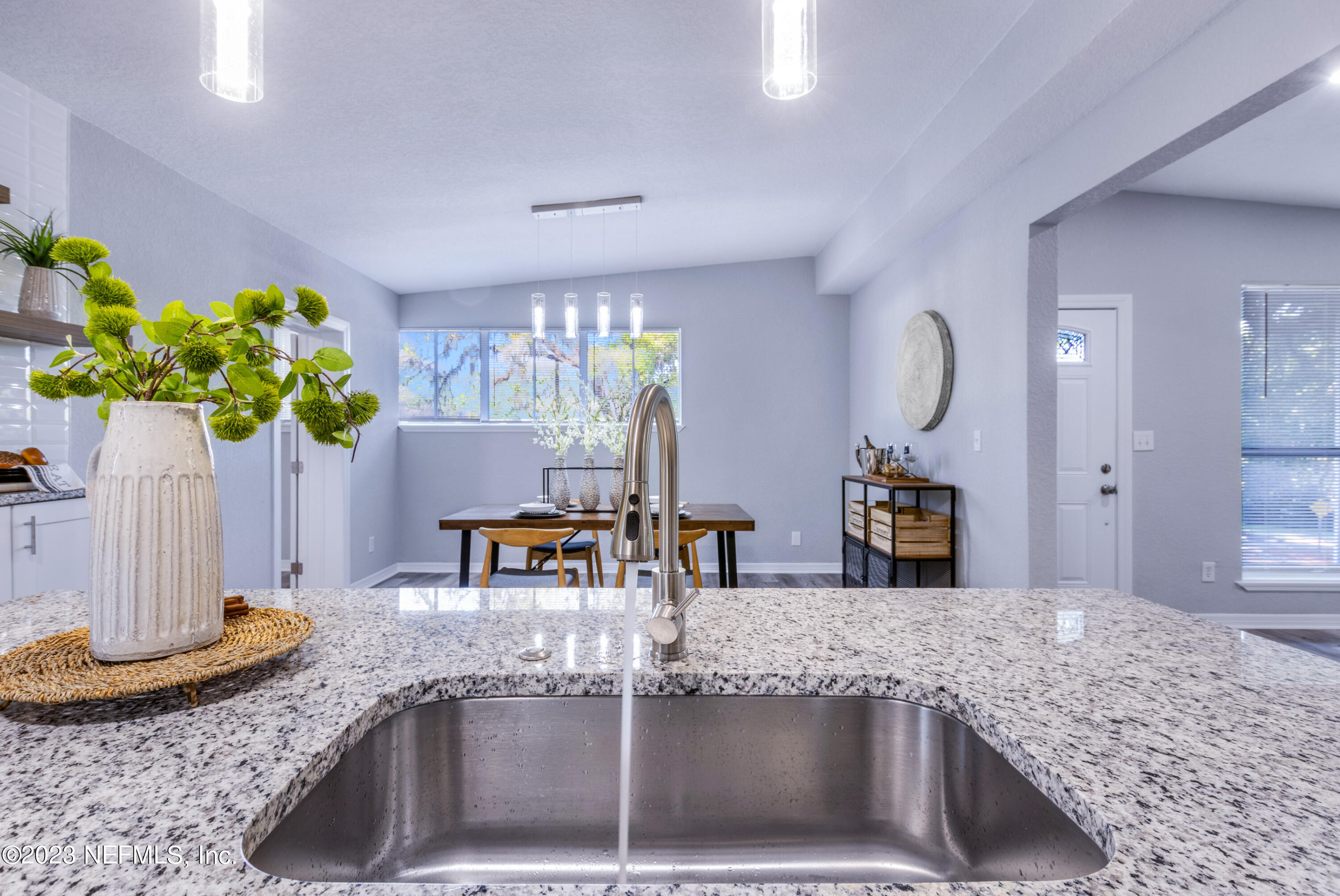 1226 Morgana Road Jacksonville, FL 32211 - Photo 14 of 38 a kitchen with granite countertop a sink a counter top space and stainless steel appliances