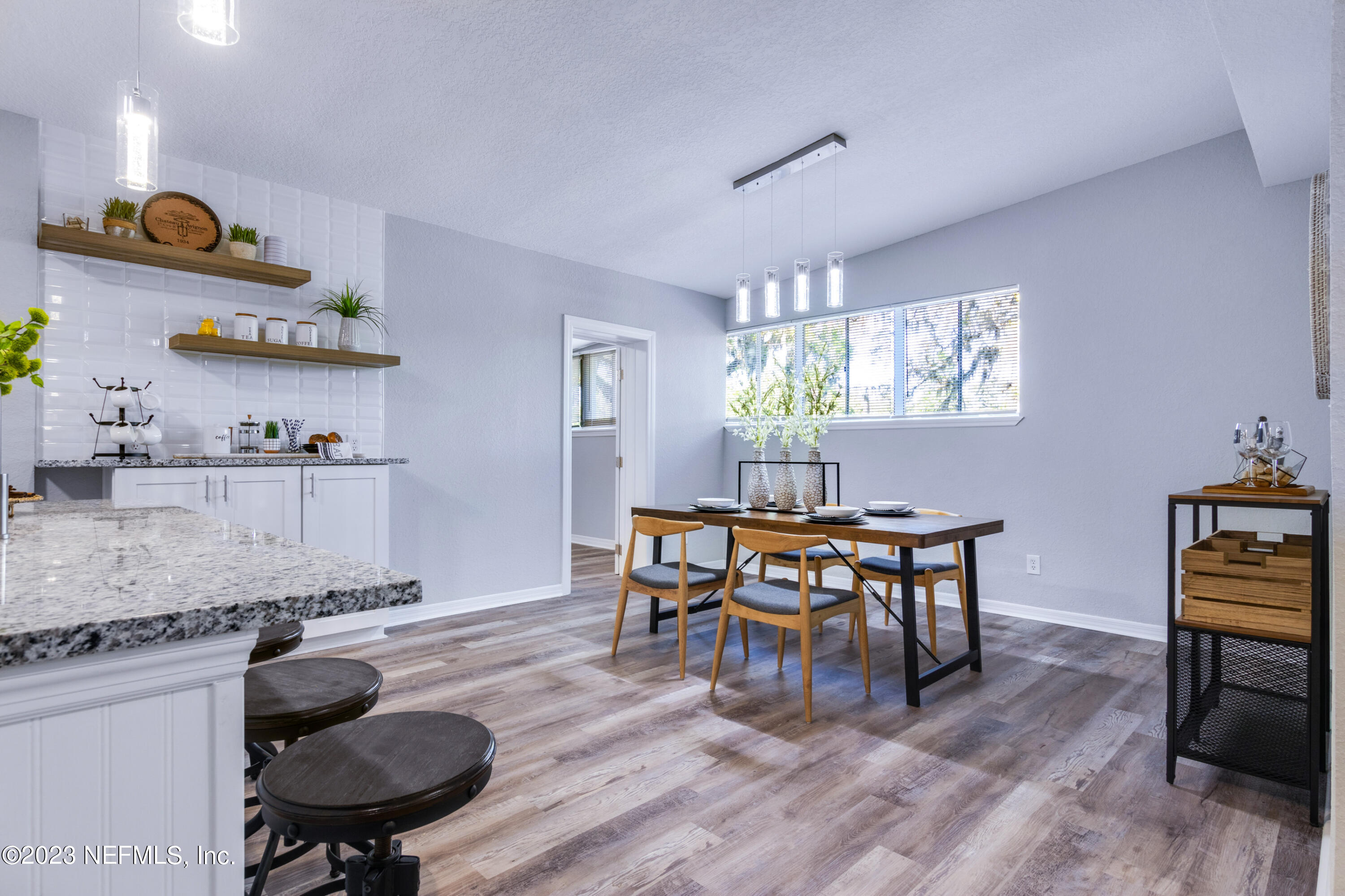 1226 Morgana Road Jacksonville, FL 32211 - Photo 16 of 38 a view of a dining room with furniture and wooden floor