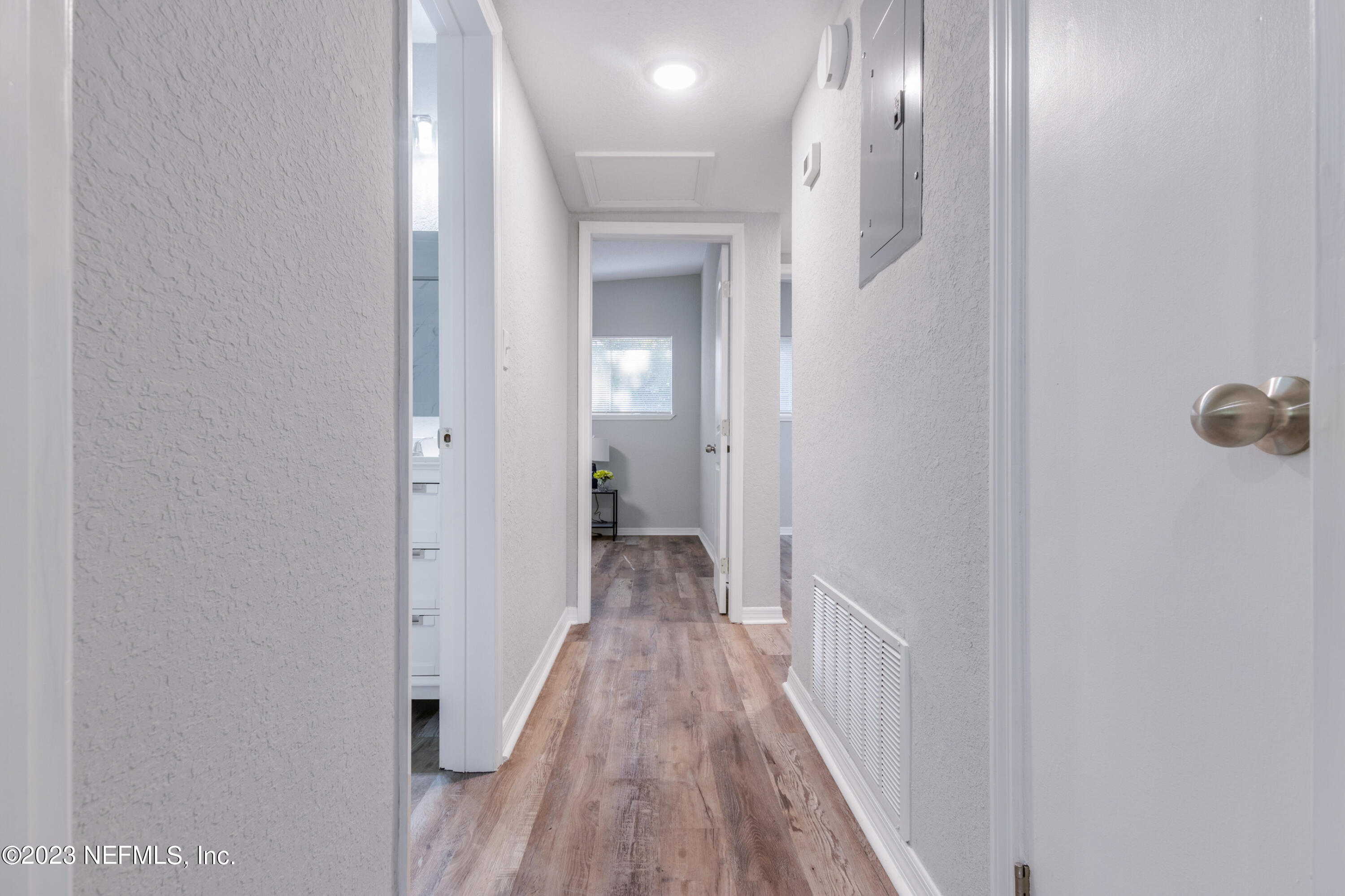 1226 Morgana Road Jacksonville, FL 32211 - Photo 18 of 38 a view of a hallway with wooden floor