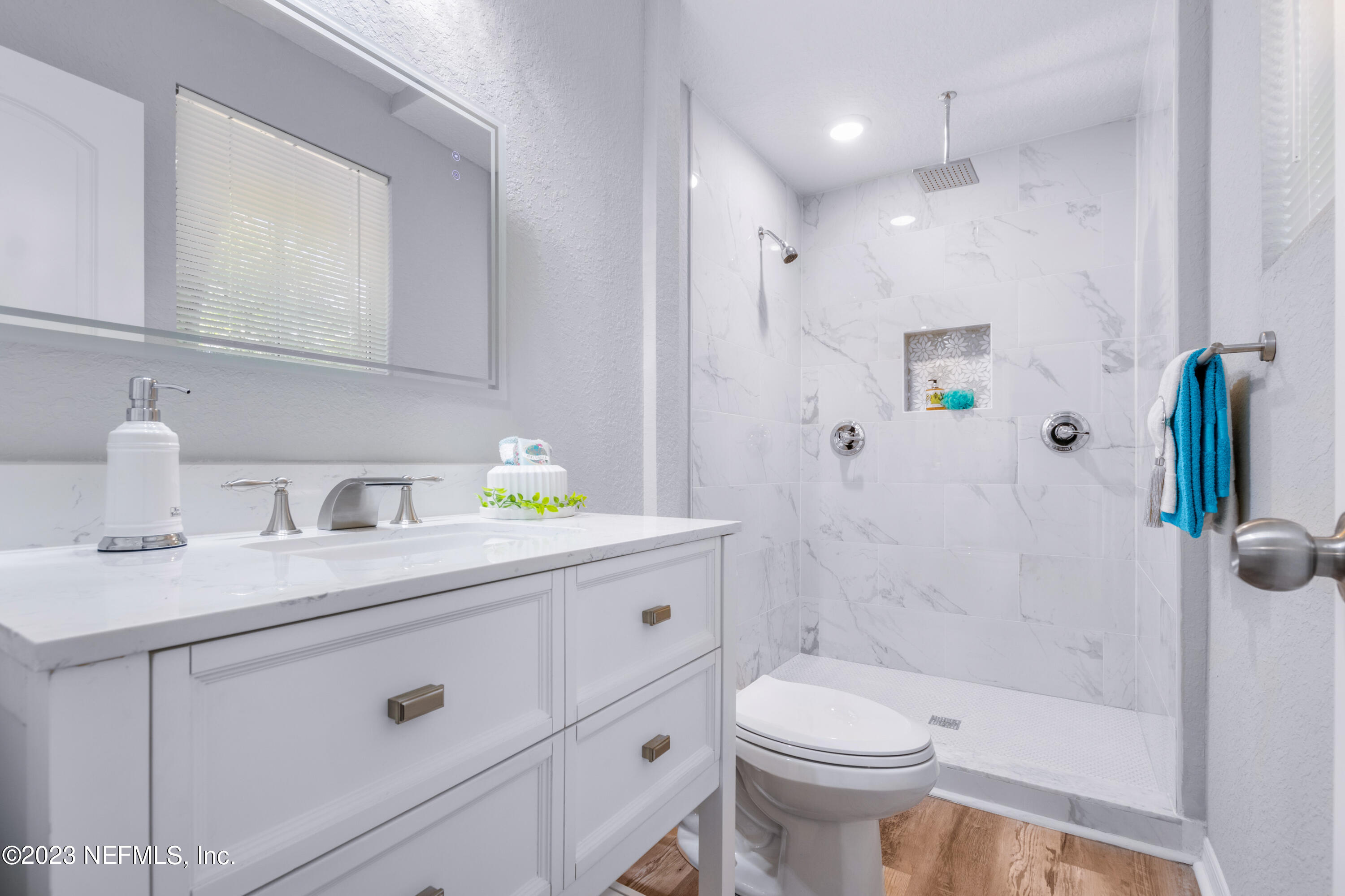 1226 Morgana Road Jacksonville, FL 32211 - Photo 20 of 38 a bathroom with a sink a toilet and shower