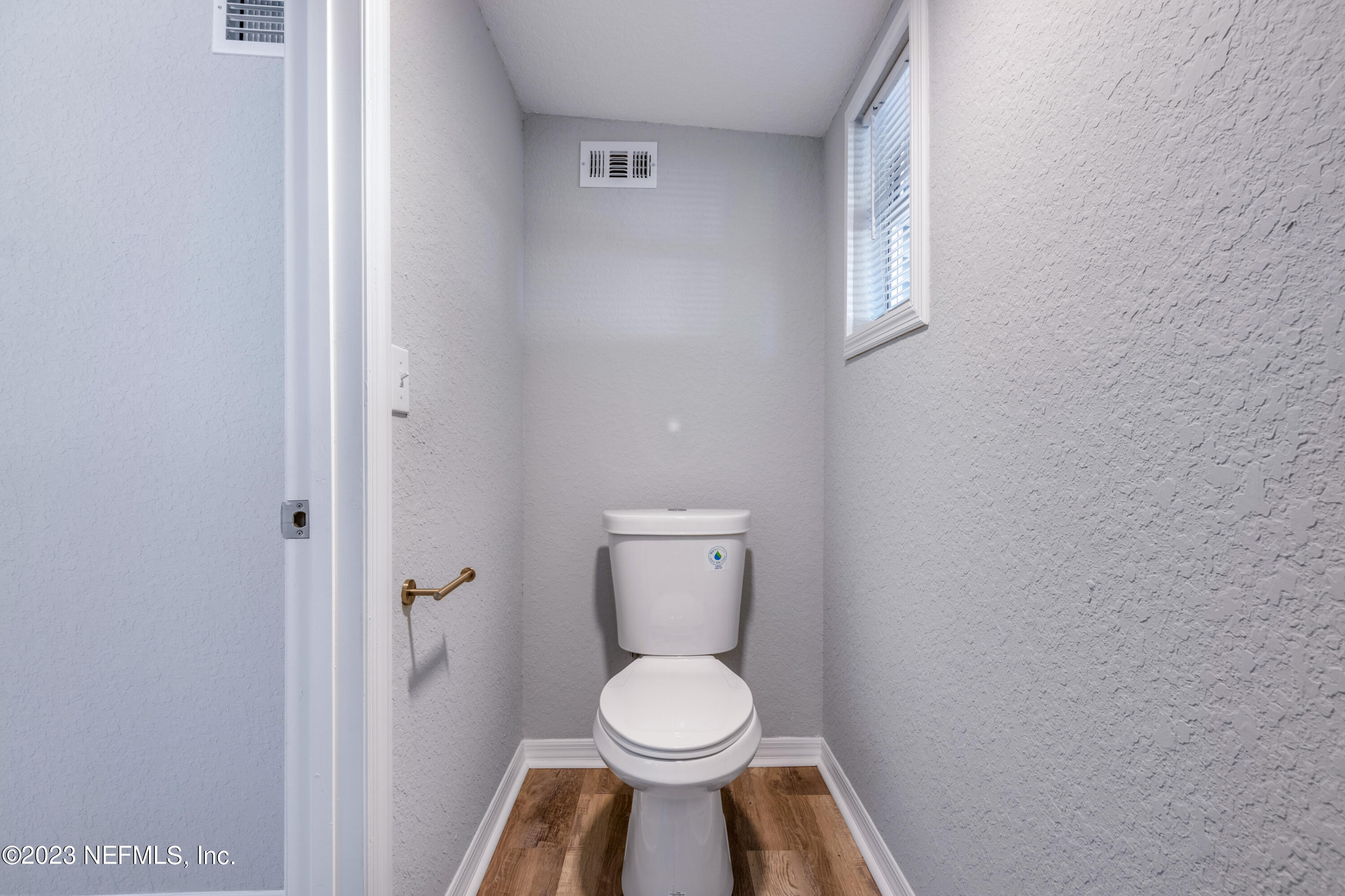 1226 Morgana Road Jacksonville, FL 32211 - Photo 30 of 38 a white toilet sitting in a bathroom