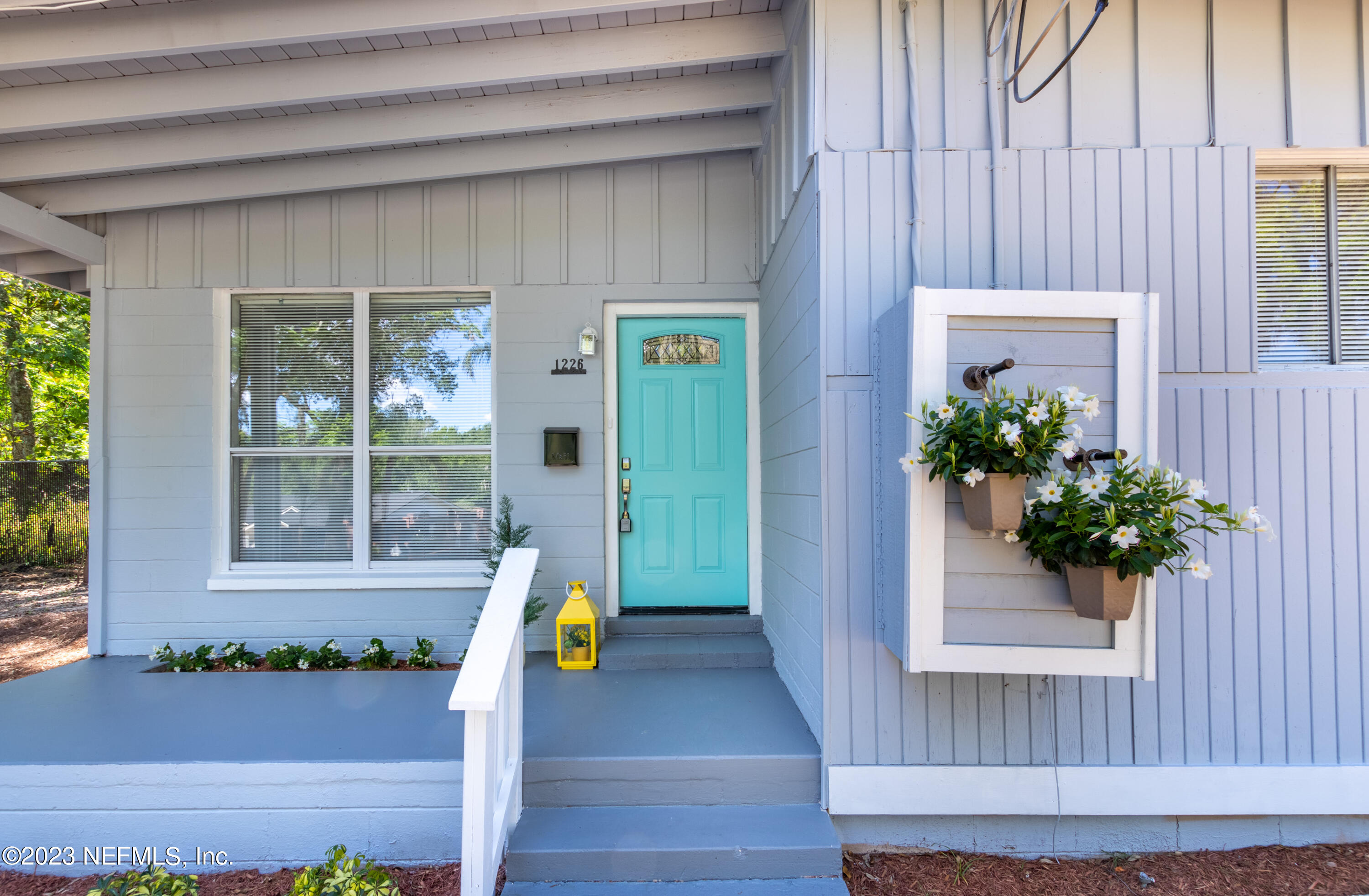 1226 Morgana Road Jacksonville, FL 32211 - Photo 3 of 38 a front view of a house with a potted plant and a window