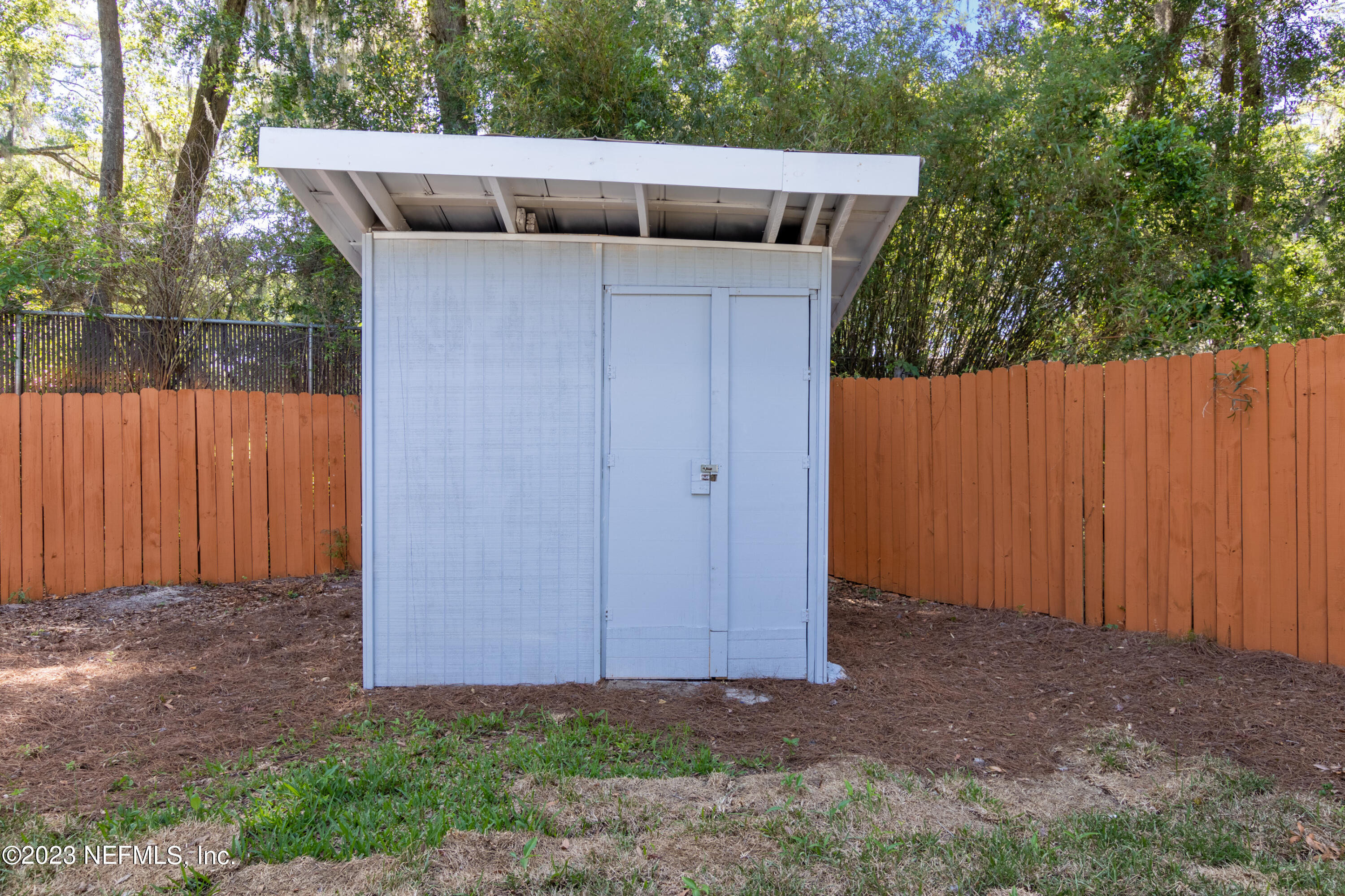 1226 Morgana Road Jacksonville, FL 32211 - Photo 37 of 38 a view of backyard with cabin and wooden fence