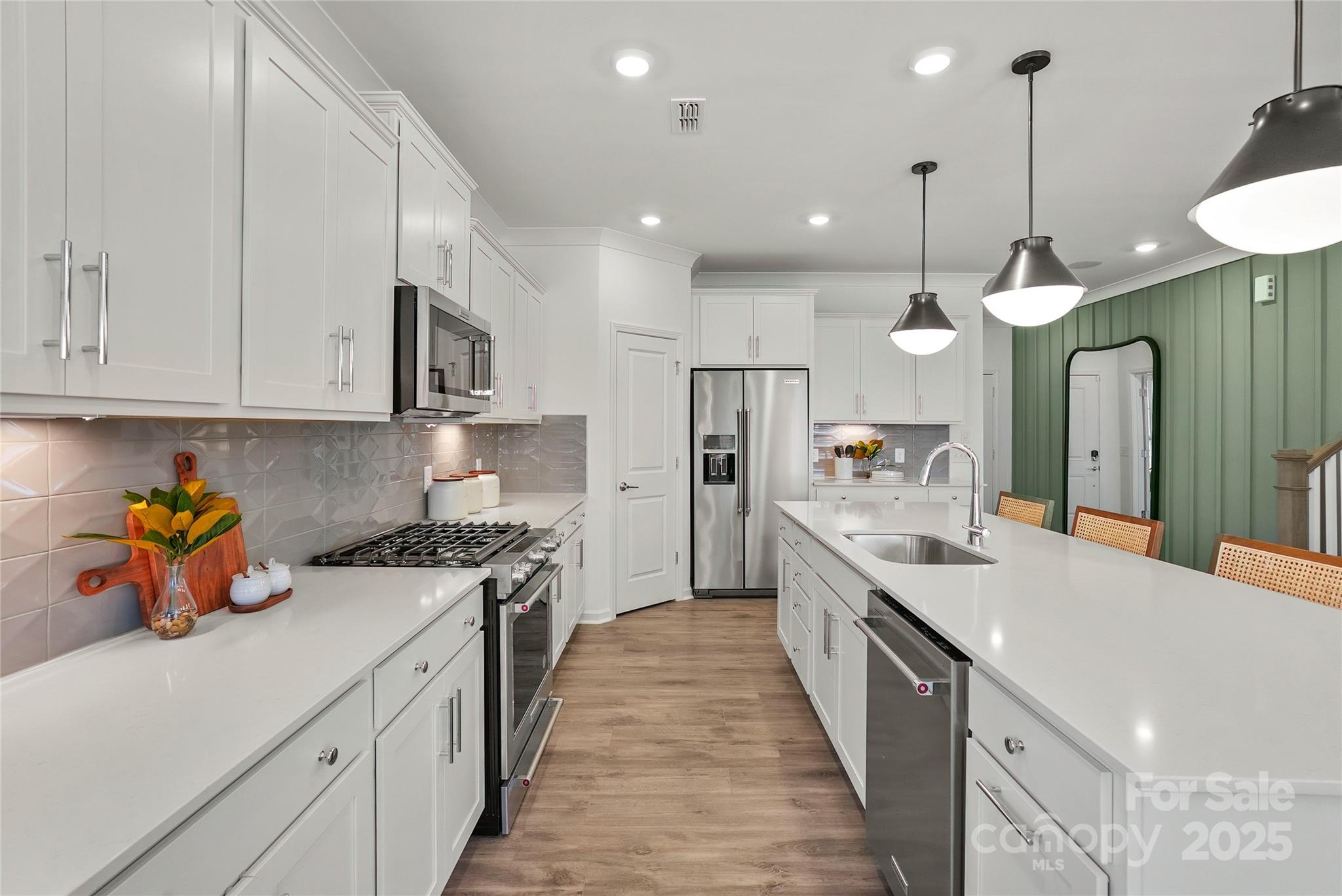 2213 Dickson Court, Unit 52 Monroe, NC 28110 - Photo 13 of 48 a large kitchen with kitchen island a sink a counter top space stainless steel appliances and cabinets