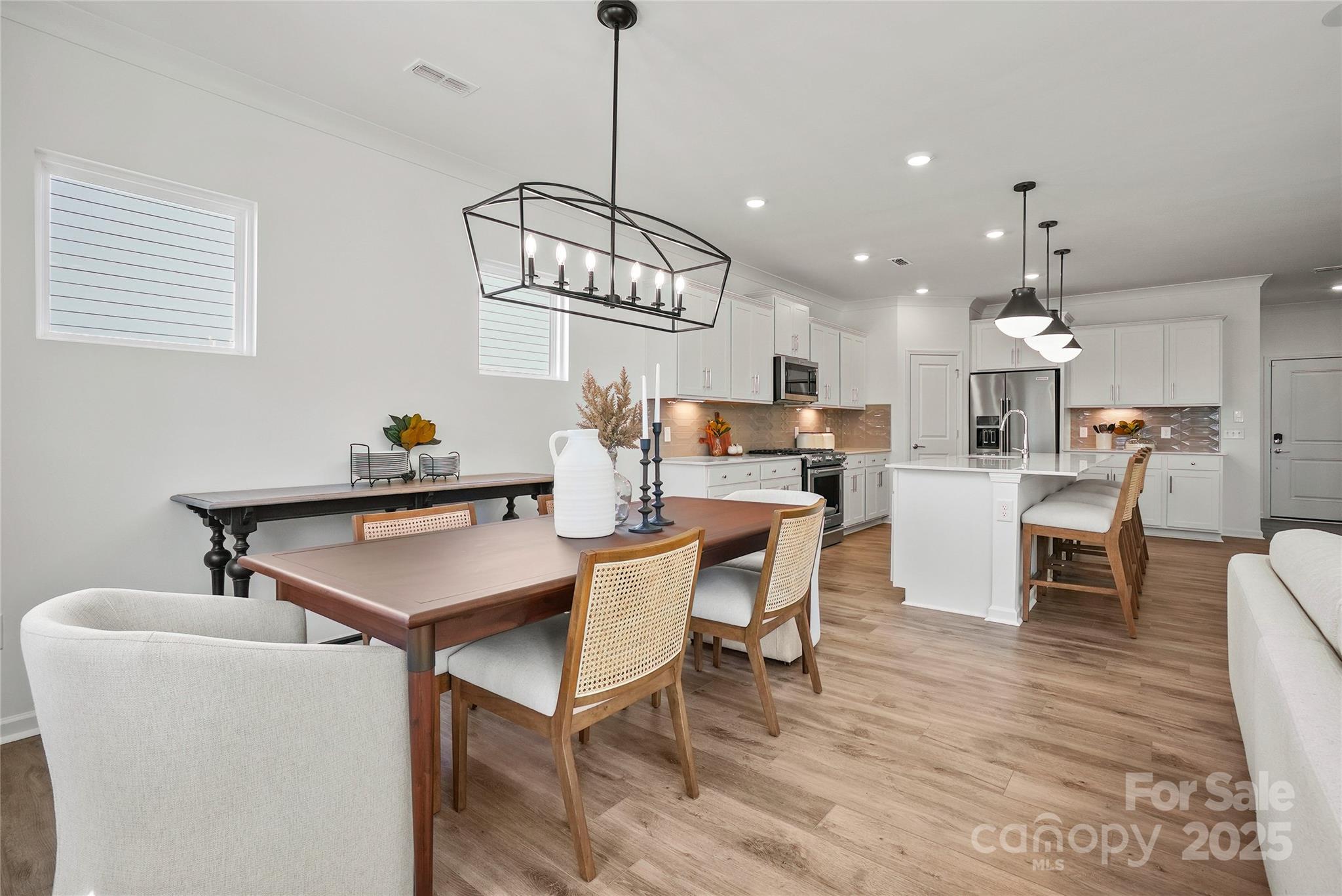 2213 Dickson Court, Unit 52 Monroe, NC 28110 - Photo 18 of 48 a view of a dining room with furniture and chandelier