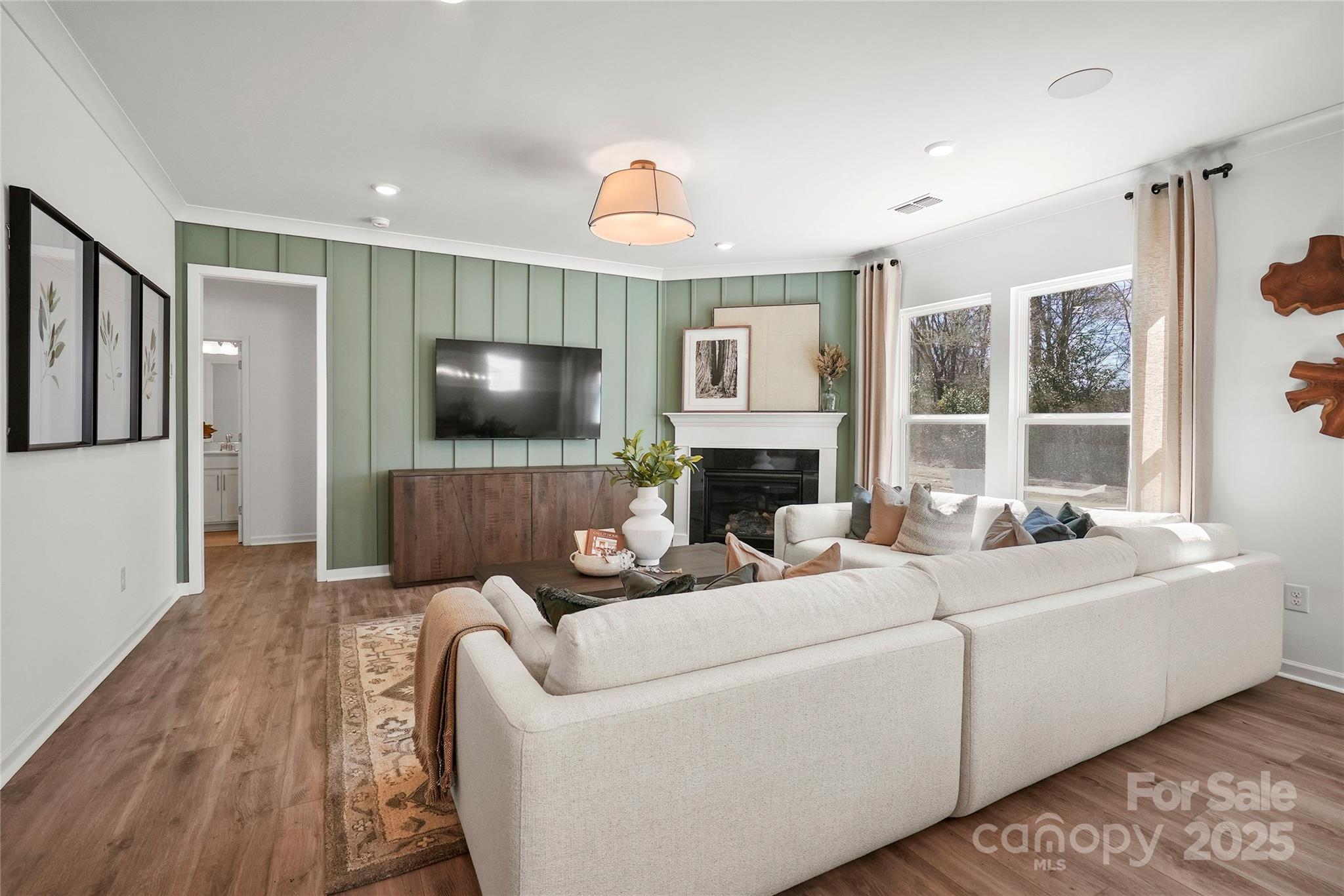 2213 Dickson Court, Unit 52 Monroe, NC 28110 - Photo 19 of 48 a living room with furniture fireplace and a flat screen tv