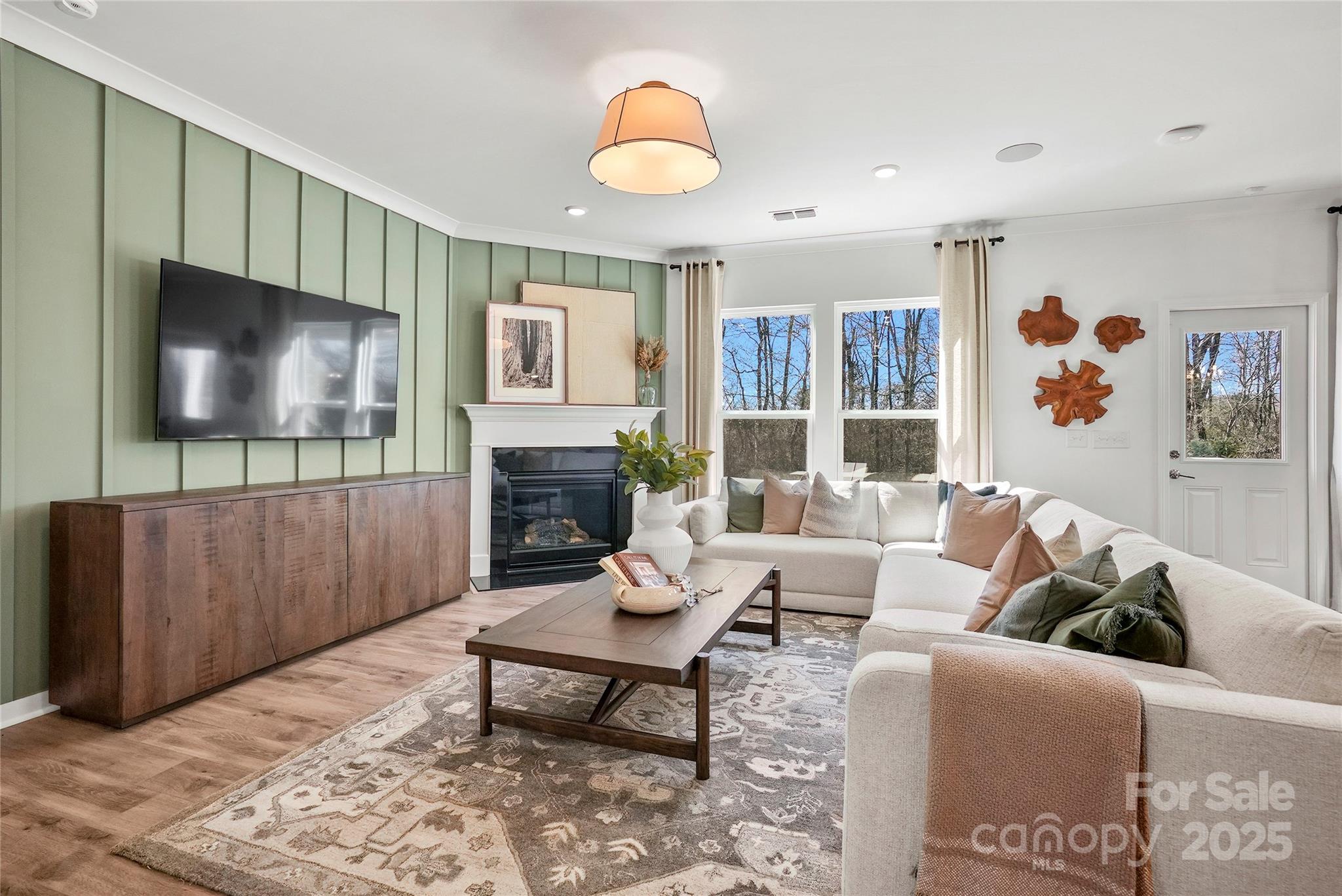 2213 Dickson Court, Unit 52 Monroe, NC 28110 - Photo 22 of 48 a living room with furniture and a flat screen tv