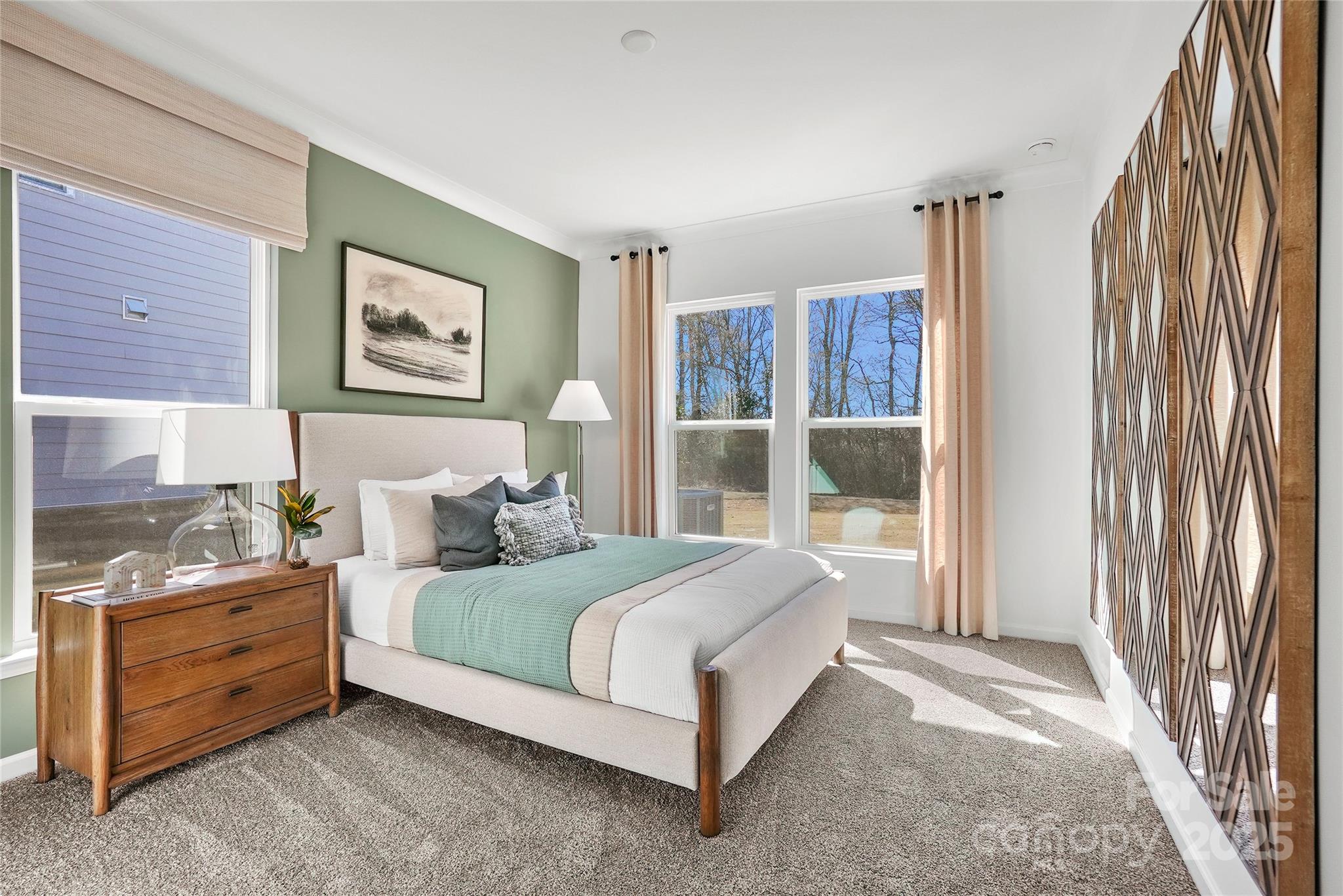 2213 Dickson Court, Unit 52 Monroe, NC 28110 - Photo 25 of 48 a bedroom with a bed lamp and a large window