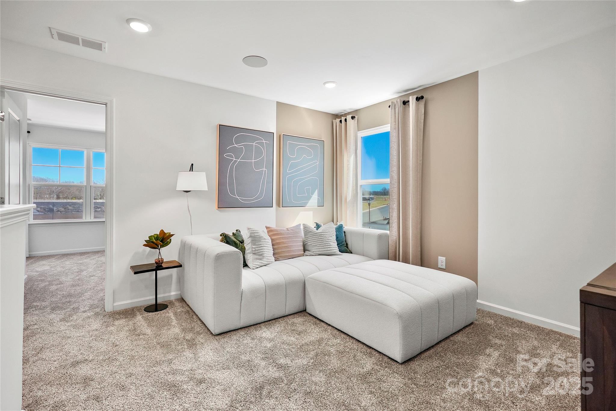 2213 Dickson Court, Unit 52 Monroe, NC 28110 - Photo 29 of 48 a spacious bedroom with a bed and a couch