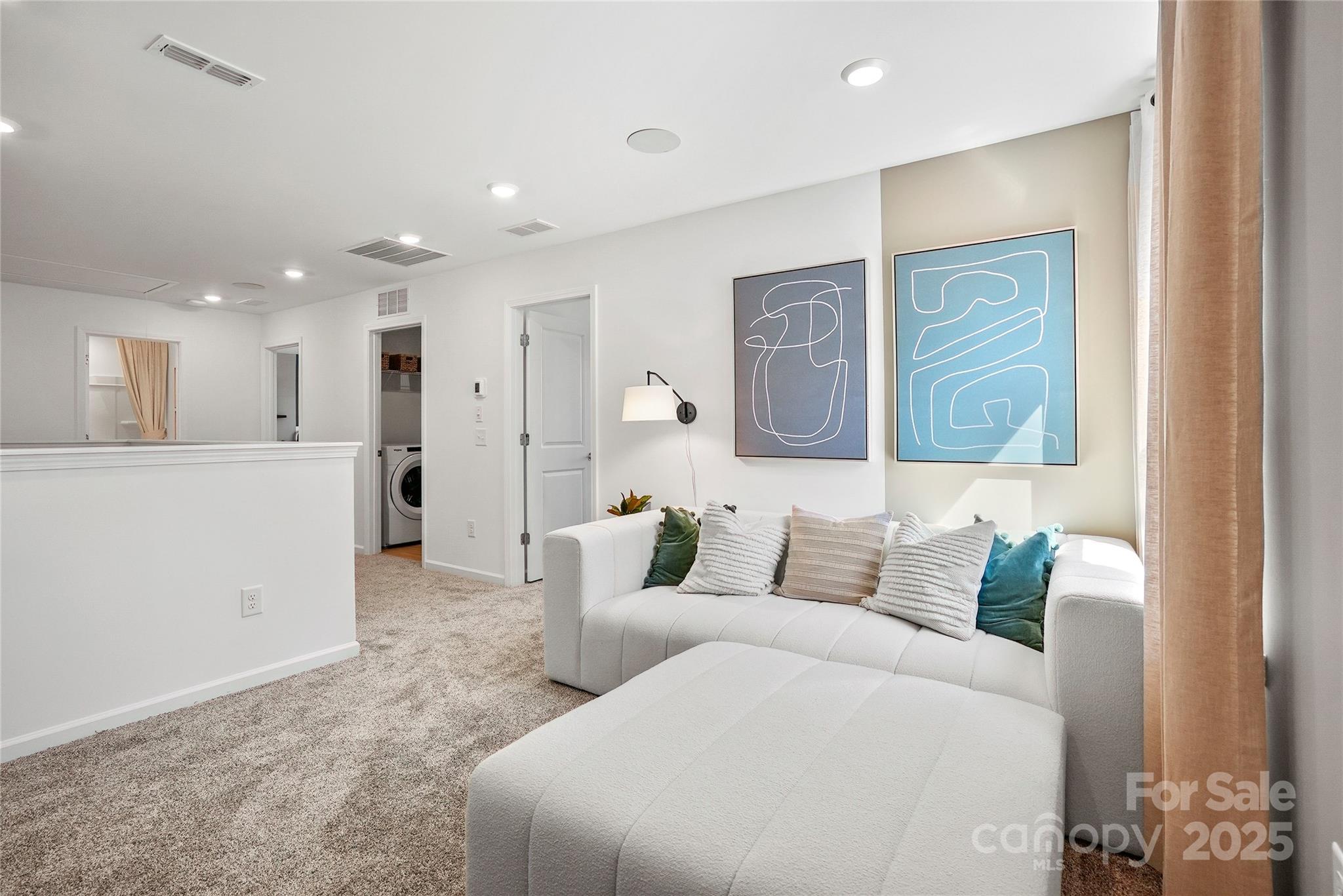 2213 Dickson Court, Unit 52 Monroe, NC 28110 - Photo 30 of 48 a living room with furniture and a painting