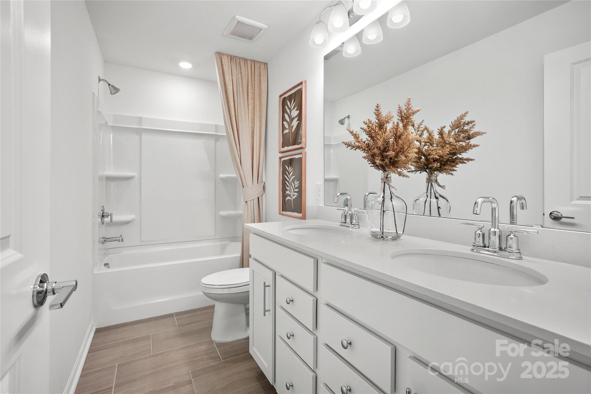 2213 Dickson Court, Unit 52 Monroe, NC 28110 - Photo 35 of 48 a bathroom with a double vanity sink mirror and toilet