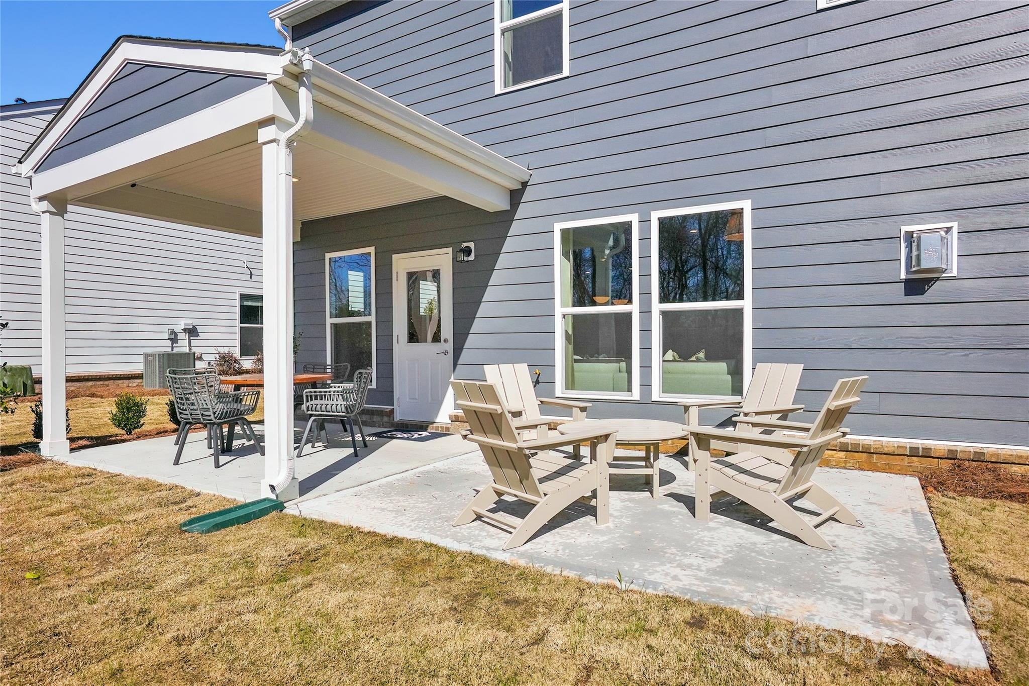 2213 Dickson Court, Unit 52 Monroe, NC 28110 - Photo 44 of 48 a building outdoor space with patio furniture and white walls