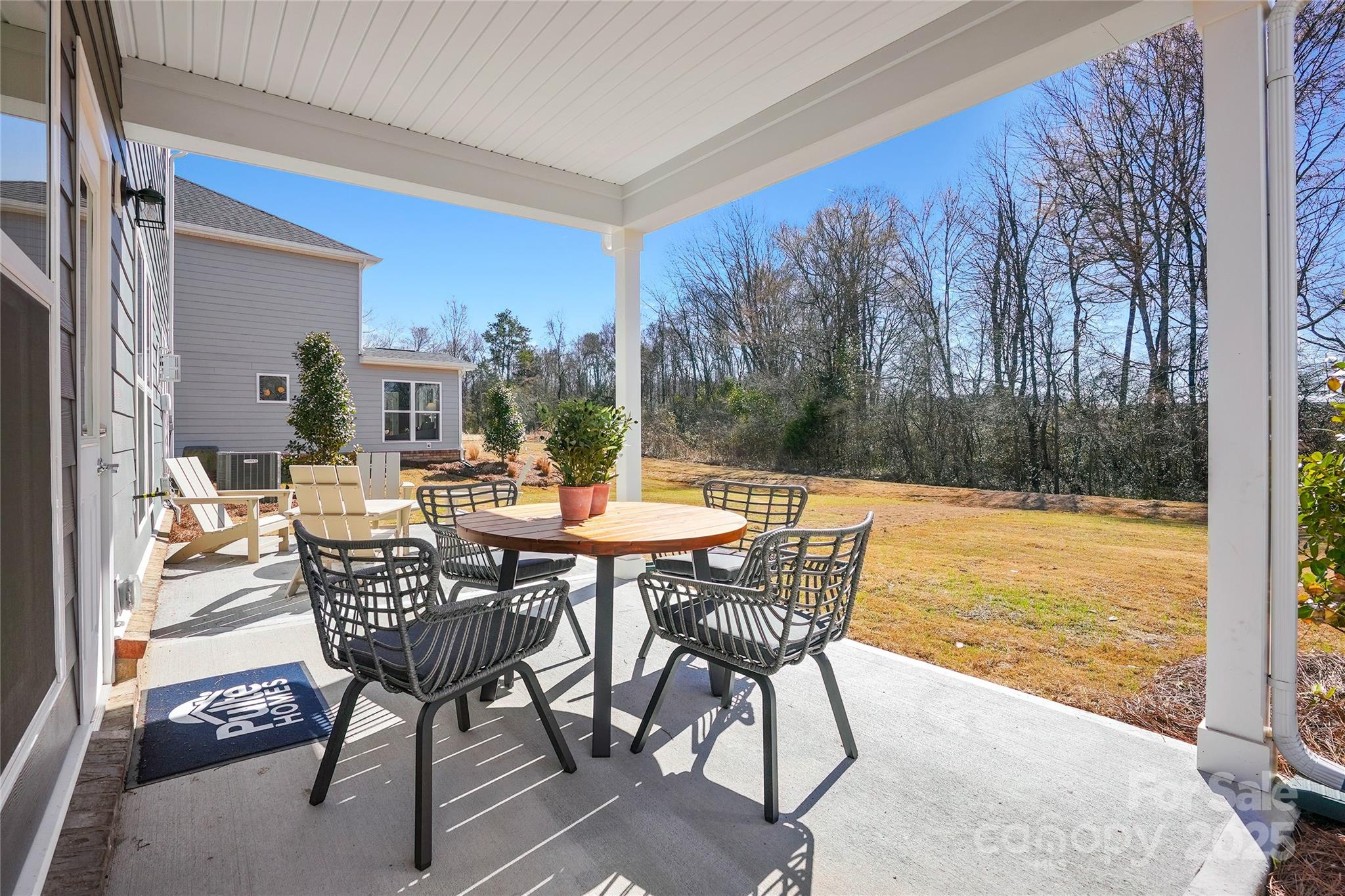 2213 Dickson Court, Unit 52 Monroe, NC 28110 - Photo 45 of 48 a view of a outdoor dining space with a table and chairs