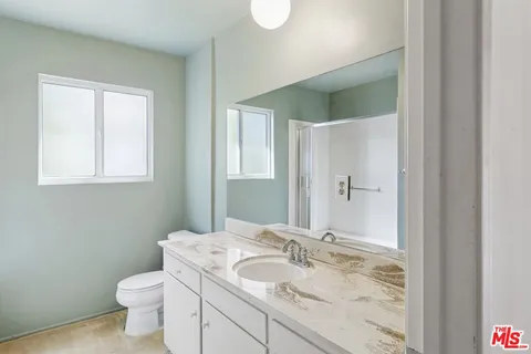 a view of a chairs and table in the patio