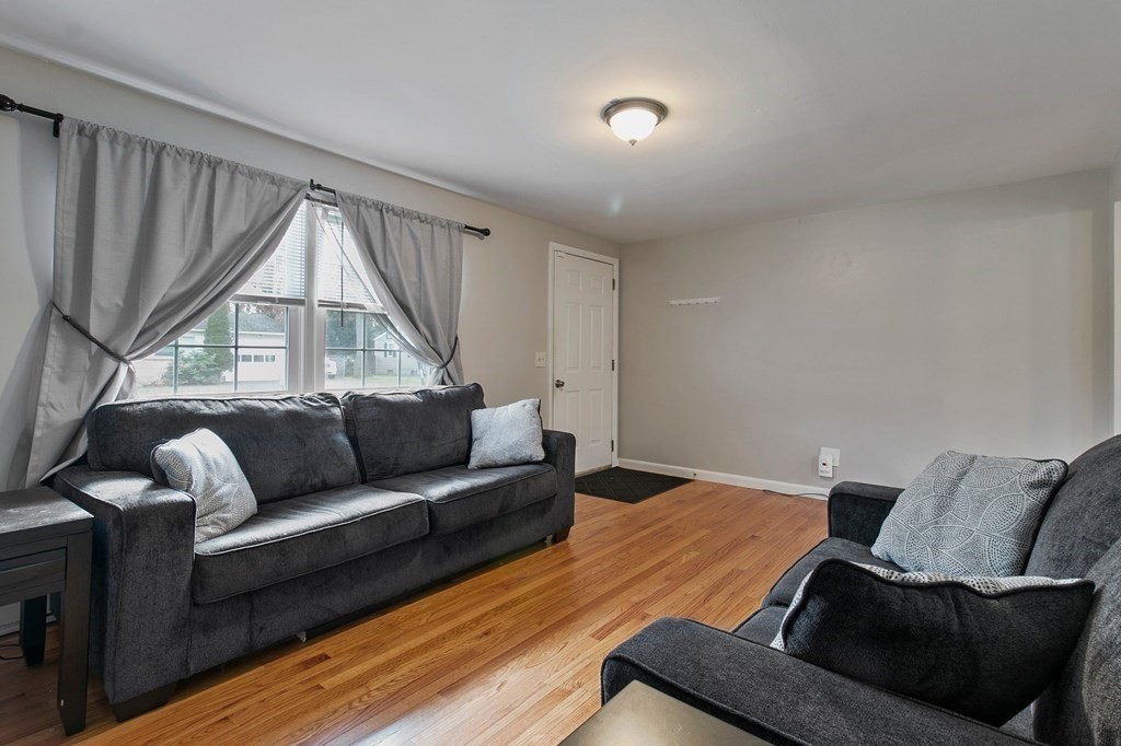 52 Portulaca Drive Springfield, MA 01129 - Photo 11 of 36 a living room with furniture and a window