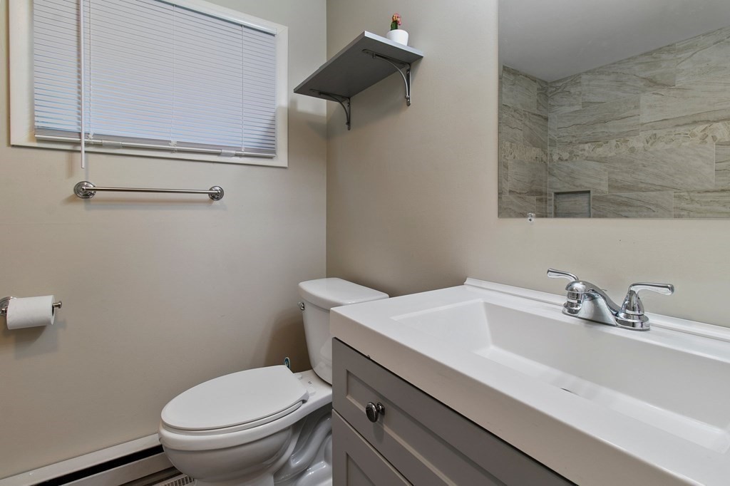 52 Portulaca Drive Springfield, MA 01129 - Photo 16 of 36 a bathroom with a sink toilet and vanity