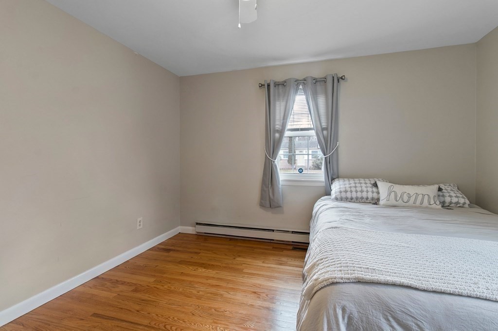 52 Portulaca Drive Springfield, MA 01129 - Photo 19 of 36 a bedroom with a bed and a window