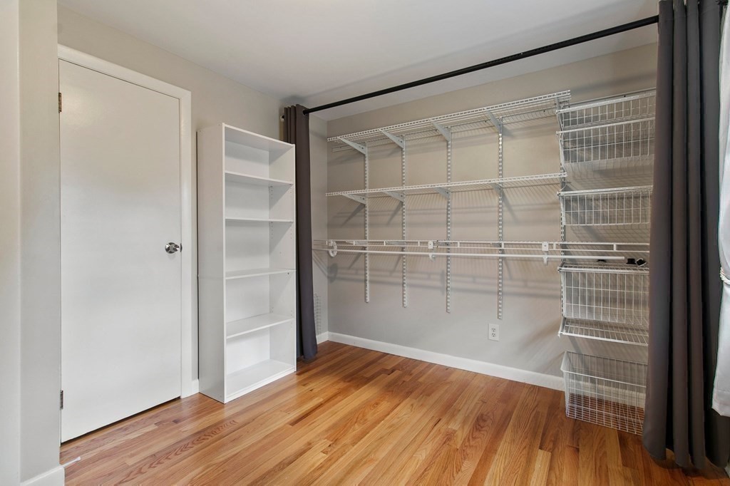 52 Portulaca Drive Springfield, MA 01129 - Photo 21 of 36 a view of a room with wooden floor