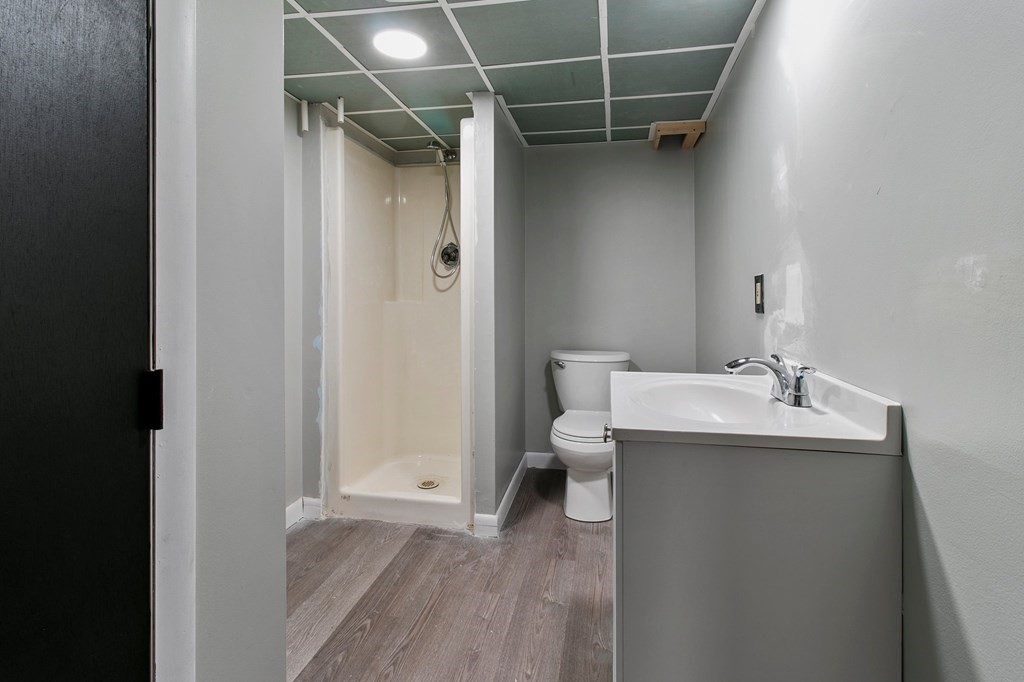 52 Portulaca Drive Springfield, MA 01129 - Photo 26 of 36 a bathroom with a sink and mirror with toilet
