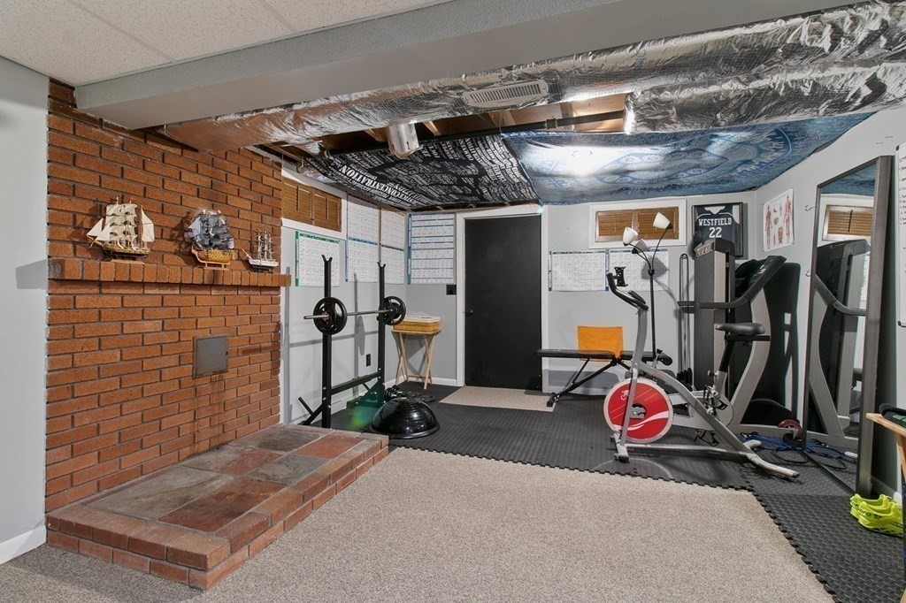 52 Portulaca Drive Springfield, MA 01129 - Photo 27 of 36 a view of a room with gym equipment