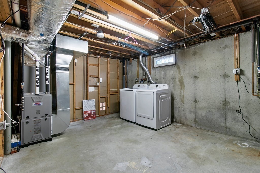 52 Portulaca Drive Springfield, MA 01129 - Photo 30 of 36 a utility room with dryer and washer