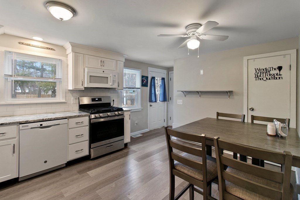 52 Portulaca Drive Springfield, MA 01129 - Photo 5 of 36 a kitchen with a stove a sink and a refrigerator