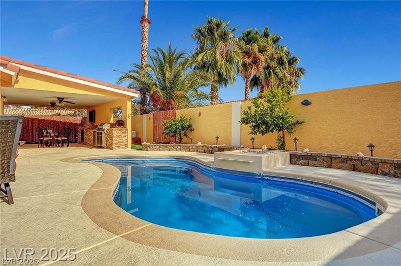 2410 Doherty Way Henderson, NV 89014 - Photo 3 of 63 View of swimming pool with a fenced backyard, ceiling fan, and a patio area