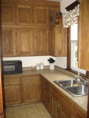 804 8th Street Rochelle, IL 61068 - Photo 3 of 6 a kitchen with stainless steel appliances granite countertop a sink a stove and a microwave oven with granite countertops