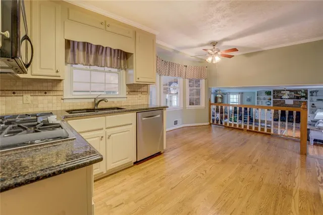 a view of a livingroom with hardwood and furniture